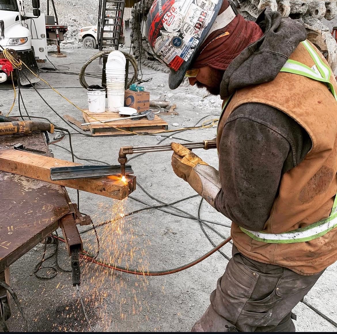 Wild Horse crew member cutting steel on site