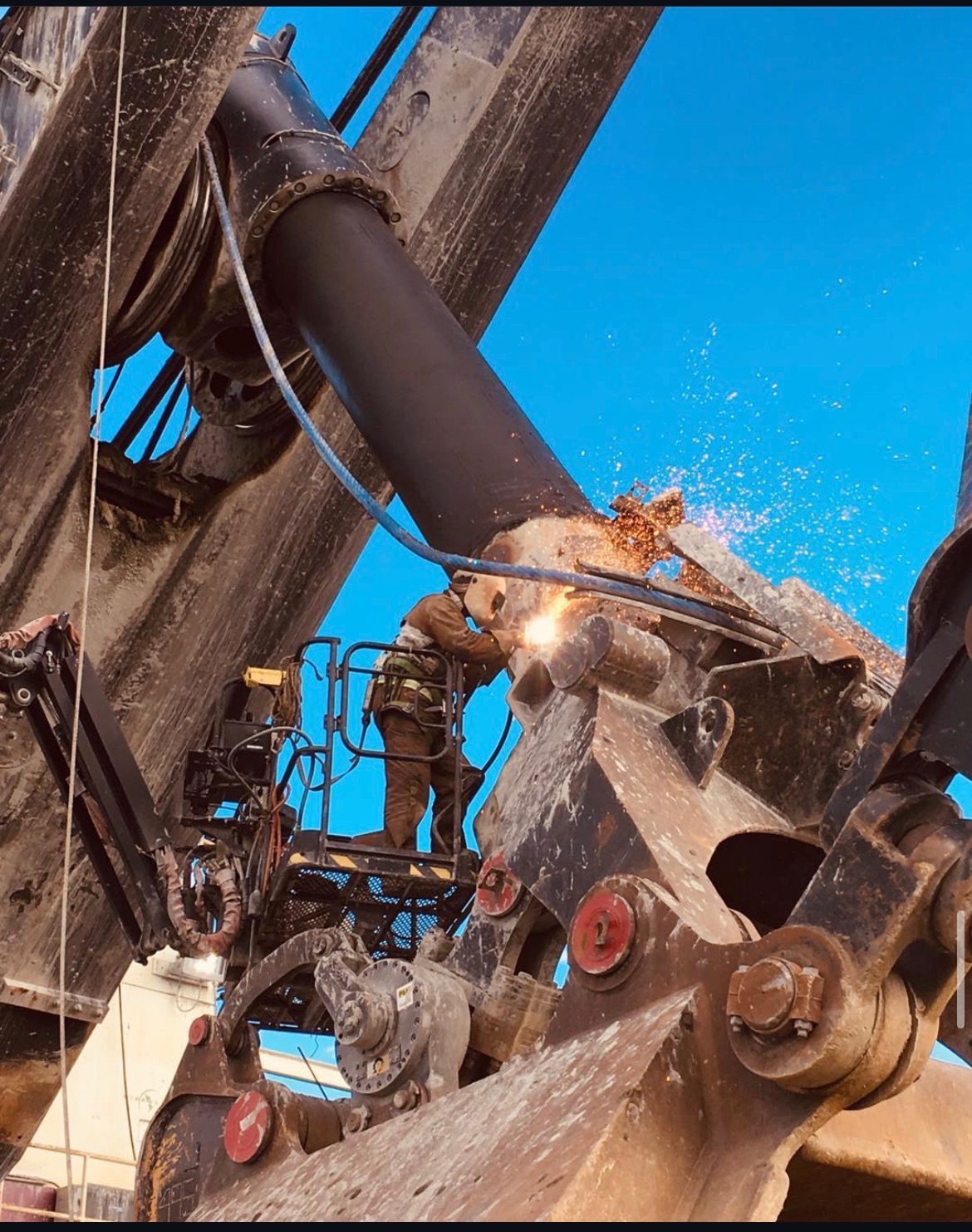Wild Horse crew welding on heavy mining equipment